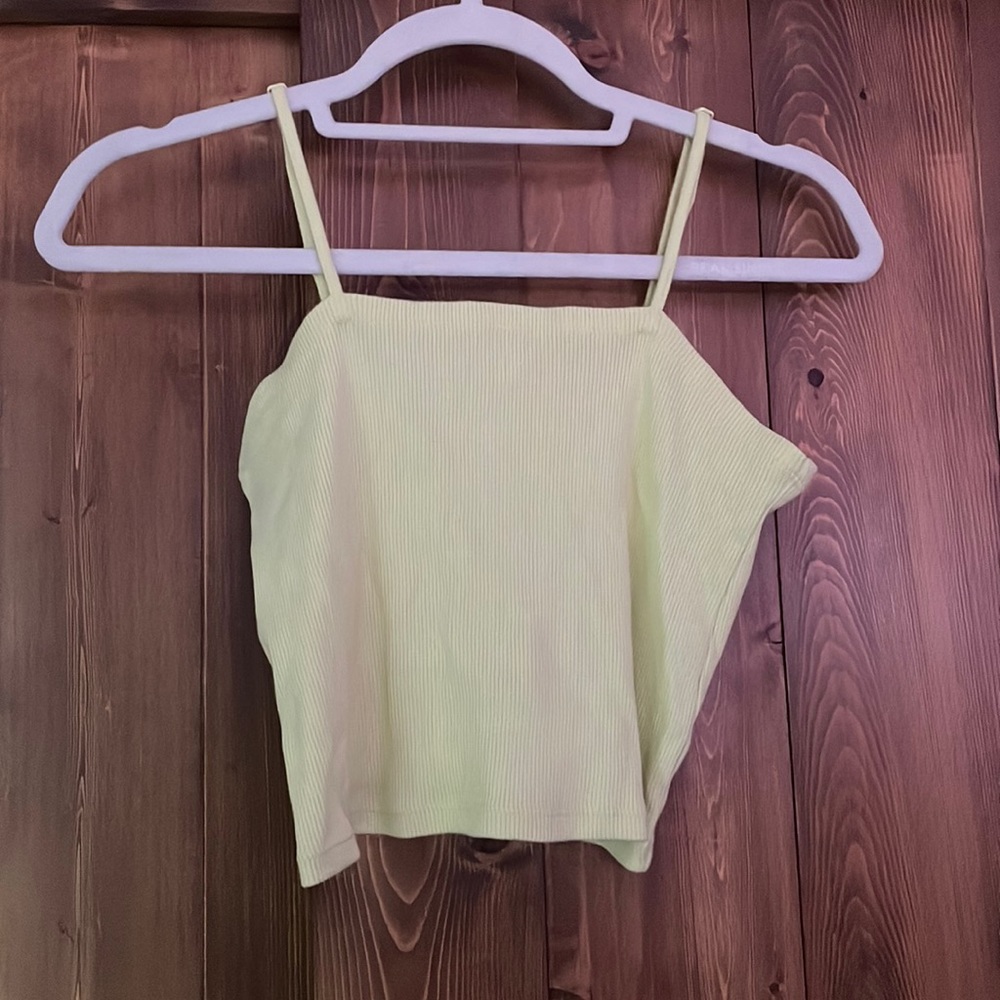 Light yellow tank top from Aerie. Adjustable straps and squared top.